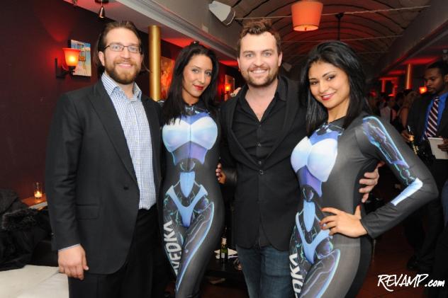 One Lounge co-owners Niko Papademetriou and Seth McClelland are flanked by the party's Svedka models.